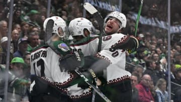 Nov 14, 2023; Dallas, Texas, USA; Arizona Coyotes left wing Lawson Crouse (67) and left wing Matias Maccelli (63) and center Nick Bjugstad (17) and defenseman Sean Durzi (50) celebrates after Crouse scores a goal against Dallas Stars goaltender Jake Oettinger (29) during the third period at the American Airlines Center. Mandatory Credit: Jerome Miron-USA TODAY Sports