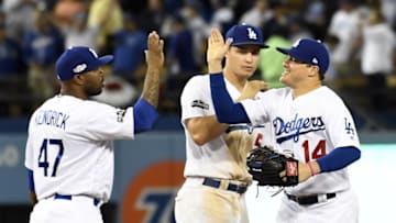 Oct 18, 2016; Los Angeles, CA, USA; Los Angeles Dodgers left fielder Enrique Hernandez (14) celebrates with left fielder Howie Kendrick (47) after beating the Chicago Cubs in game three of the 2016 NLCS playoff baseball series at Dodger Stadium. Mandatory Credit: Richard Mackson-USA TODAY Sports