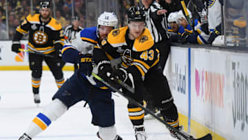 BOSTON, MA - JUNE 12: Danton Heinen #43 of the Boston Bruins fights for the puck against Zach Sanford #12 of the St Louis Blues during Game Seven of the 2019 NHL Stanley Cup Final at the TD Garden on June 12, 2019 in Boston, Massachusetts. (Photo by Brian Babineau/NHLI via Getty Images)