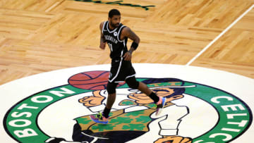 BOSTON, MASSACHUSETTS - DECEMBER 18: Kyrie Irving #11 of the Brooklyn Nets runs over the Celtics logo during the preseason game between the Nets and the Boston Celtics at TD Garden on December 18, 2020 in Boston, Massachusetts. NOTE TO USER: User expressly acknowledges and agrees that, by downloading and or using this photograph, User is consenting to the terms and conditions of the Getty Images License Agreement. (Photo by Maddie Meyer/Getty Images)