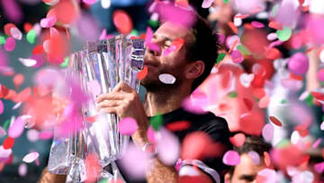INDIAN WELLS, CA - MARCH 18: Juan Martin Del Potro of Argentina holds up the trophy in front of Roger Federer of Switzerland after his victory in the ATP final during the BNP Paribas Open at the Indian Wells Tennis Garden on March 18, 2018 in Indian Wells, California. (Photo by Harry How/Getty Images)