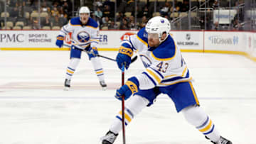Oct 7, 2022; Pittsburgh, Pennsylvania, USA; Buffalo Sabres center Sean Malone (43) shoots the puck against the Pittsburgh Penguins during the third period at PPG Paints Arena. Mandatory Credit: Charles LeClaire-USA TODAY Sports