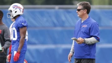 Jun 18, 2014; Buffalo, NY, USA; Buffalo Bills defensive coordinator Jim Schwartz watches play during the Bills Minicamp at Ralph Wilson Stadium. Mandatory Credit: Kevin Hoffman-USA TODAY Sports