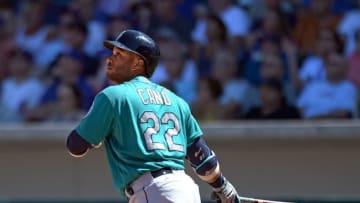 Mar 27, 2016; Mesa, AZ, USA; Seattle Mariners second baseman Robinson Cano (22) hits a three run home run during the second inning against the Chicago Cubs at Sloan Park. Mandatory Credit: Jake Roth-USA TODAY Sports