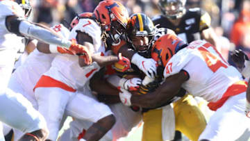 IOWA CITY, IOWA- NOVEMBER 23: Running back Toren Young #28 of the Iowa Hawkeyes is tackled during the second half by defensive back Stanley Green #7, linebacker Khalan Tolson #45, linebacker Dele Harding #9 and defensive lineman Oluwole Betiku #47 of the Illinois Fighting Illini on November 23, 2019 at Kinnick Stadium in Iowa City, Iowa. (Photo by Matthew Holst/Getty Images)