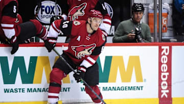 Mar 17, 2016; Glendale, AZ, USA; Arizona Coyotes center Antoine Vermette (50) looks to pass during the second period against the San Jose Sharks at Gila River Arena. Mandatory Credit: Matt Kartozian-USA TODAY Sports