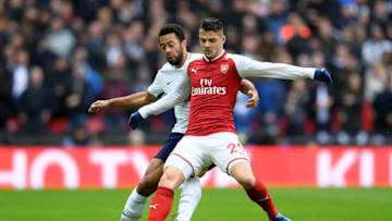 LONDON, ENGLAND - FEBRUARY 10: Mousa Dembele of Tottenham Hotspur and Granit Xhaka of Arsenal battle for the ball during the Premier League match between Tottenham Hotspur and Arsenal at Wembley Stadium on February 10, 2018 in London, England. (Photo by Laurence Griffiths/Getty Images)