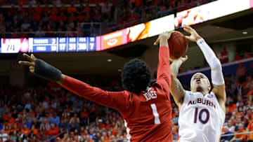AUBURN, ALABAMA - FEBRUARY 12: Samir Doughty #10 of the Auburn Tigers has his shot blocked by Herbert Jones #1 of the Alabama Crimson Tide in the second half at Auburn Arena on February 12, 2020 in Auburn, Alabama. (Photo by Kevin C. Cox/Getty Images)