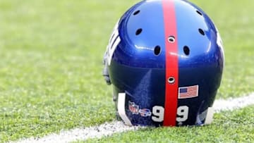 Aug 18, 2013; East Rutherford, NJ, USA; Helmet of New York Giants defensive tackle Cullen Jenkins (not pictured) with a "Heads Up Football" sticker during warmups before a preseason game against the Indianapolis Colts at MetLife Stadium. Mandatory Credit: Brad Penner-USA TODAY Sports