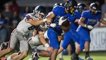 Auburn footballCatholic's Jeremiah Cobb (23) sheds tacklers as he runs into the end zone for a touchdown at Montgomery Catholic Preparatory School in Montgomery, Ala., on Friday, Oct. 15, 2021. Catholic defeated Trinity 52-7.