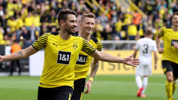 Raphael Guerreiro celebrates after scoring (Photo by Lars Baron/Getty Images)