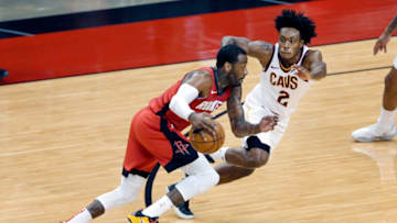 Mar 1, 2021; Houston, Texas, USA; Houston Rockets guard John Wall (left) drives around Cleveland Cavaliers guard Collin Sexton (2) during the first half at the Toyota Center. Mandatory Credit: Michael Wyke-POOL PHOTOS-USA TODAY Sports