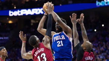 Philadelphia 76ers center Joel Embiid (21) passes the ball over Miami Heat center Bam Adebayo (13) and forward P.J. Tucker (17) during the third quarter( Bill Streicher-USA TODAY Sports)