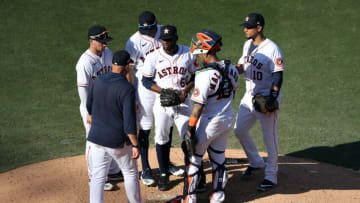 SAN DIEGO, CALIFORNIA - OCTOBER 15: Enoli Paredes #60 of the Houston Astros talks with pitching coach Brent Strom #56 at the mound during the fourth inning against the Tampa Bay Rays in Game Five of the American League Championship Series at PETCO Park on October 15, 2020 in San Diego, California. (Photo by Sean M. Haffey/Getty Images)