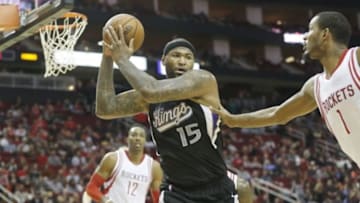 Dec 5, 2015; Houston, TX, USA; Sacramento Kings forward DeMarcus Cousins (15) defended by Houston Rockets forward Trevor Ariza (1) in the second half at Toyota Center. Rockets won 120-111. Mandatory Credit: Thomas B. Shea-USA TODAY Sports