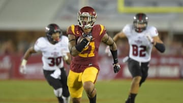 Sep 5, 2015; Los Angeles, CA, USA; Southern California Trojans linebacker Su'a Cravens (21) carries the ball on a 32-yard interception return in the third quarter against the Arkansas State Red Wolves at Los Angeles Memorial Coliseum. Mandatory Credit: Kirby Lee-USA TODAY Sports