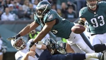 Nov 23, 2014; Philadelphia, PA, USA; Philadelphia Eagles inside linebacker Mychal Kendricks (95) and linebacker Brandon Graham (55) pressure Tennessee Titans quarterback Zach Mettenberger (7) during the first quarter at Lincoln Financial Field. Mandatory Credit: Eric Hartline-USA TODAY Sports