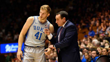 Former Duke basketball head coach Mike Krzyzewski and Jack White (Photo by Grant Halverson/Getty Images)