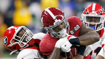 Georgia Bulldogs linebacker Quay Walker (7) brings down Alabama Crimson Tide linebacker Kendrick Blackshire (40) on Monday, Jan. 10, 2022, during the College Football Playoff National Championship at Lucas Oil Stadium in Indianapolis.