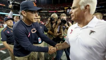 Chicago Bears head coach Marc Trestman (left) greets Atlanta Falcons head coach Mike Smith after their game at the Georgia Dome. The Bears won 27-13. Mandatory Credit: Jason Getz-USA TODAY Sports