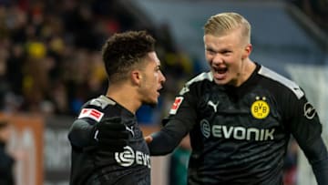 AUGSBURG, GERMANY - JANUARY 18: (BILD ZEITUNG OUT) Jadon Sancho of Borussia Dortmund and Erling Haaland of Borussia Dortmund celebrates after scoring his team's third goalduring the Bundesliga match between FC Augsburg and Borussia Dortmund at WWK-Arena on January 18, 2020 in Augsburg, Germany. (Photo by TF-Images/Getty Images)