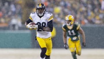 Dec 22, 2013; Green Bay, WI, USA; Pittsburgh Steelers cornerback Cortez Allen (28) returns an interception for a touchdown during the third quarter against the Green Bay Packers at Lambeau Field. Pittsburgh won 38-31. Mandatory Credit: Jeff Hanisch-USA TODAY Sports
