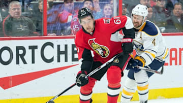Feb 16, 2016; Ottawa, Ontario, CAN; Ottawa Senators right wing Mark Stone (61) skates with the puck in front of Buffalo Sabres defenseman Josh Gorges (4) in the second period at the Canadian Tire Centre. Mandatory Credit: Marc DesRosiers-USA TODAY Sports