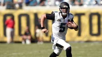 Sep 21, 2014; Jacksonville, FL, USA; Jacksonville Jaguars quarterback Blake Bortles (5) scrambles for yardage against the Indianapolis Colts during the fourth quarter at EverBank Field. The Indianapolis Colts defeated the Jacksonville Jaguars 44-17. Mandatory Credit: John David Mercer-USA TODAY Sports