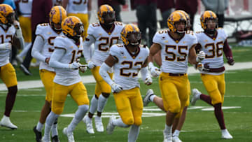 LINCOLN, NE - DECEMBER 12: Defensive back Jordan Howden #23 of the Minnesota Golden Gophers and linebacker Mariano Sori-Marin #55 lead the team on the field in the game against the Nebraska Cornhuskers in the first half at Memorial Stadium on December 12, 2020 in Lincoln, Nebraska. (Photo by Steven Branscombe/Getty Images)