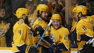 NASHVILLE, TENNESSEE - APRIL 20: Rocco Grimaldi #23 of the Nashville Predators is congratulated by teammates Ryan Ellis #4, Filip Forsberg #9, and Kyle Turris #8 after scoring a goal against the Dallas Stars during the first period of Game Five of the Western Conference First Round during the 2019 NHL Stanley Cup Playoffs at Bridgestone Arena on April 20, 2019 in Nashville, Tennessee. (Photo by Frederick Breedon/Getty Images)