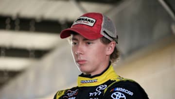 DOVER, DELAWARE - OCTOBER 04: Brandon Jones, driver of the #19 Menards/Atlas Toyoto Michael Annett, looks on from the garage during practice for the NASCAR Xfinity Series Use Your Melon Drive Sober 200 at Dover International Speedway on October 04, 2019 in Dover, Delaware. (Photo by Chris Trotman/Getty Images)