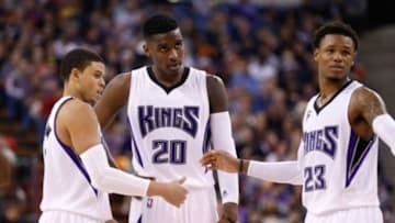 Jan 17, 2015; Sacramento, CA, USA; Sacramento Kings guard Ray McCallum (3) and guard Ben McLemore (23) speak to forward Quincy Miller (20) before his free throw against the Los Angeles Clippers during the third quarter at Sleep Train Arena. The Los Angeles Clippers defeated the Sacramento Kings 117-108. Mandatory Credit: Kelley L Cox-USA TODAY Sports