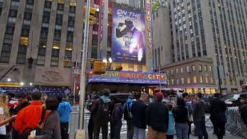 May 8, 2014; New York, NY, USA; Football fans enjoy the festivities outside of Radio City Music Hall before the 2014 NFL Draft. Mandatory Credit: Andy Marlin-USA TODAY Sports