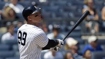 Aug 13, 2016; Bronx, NY, USA; New York Yankees right fielder Aaron Judge (99) watches a solo home run during the second inning against the Tampa Bay Rays at Yankee Stadium. Mandatory Credit: Adam Hunger-USA TODAY Sports