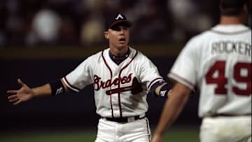 7 Oct 1998: Infielder Chipper Jones #10 and pitcher John Rocker #49 of the Atlanta Braves confer during the National League Championship Series game against the San Diego Padres at Turner Field in Atlanta, Georgia. The Padres defeated the Braves 3-2. Mandatory Credit: Doug Pensinger /Allsport