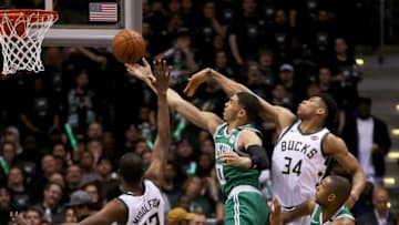 MILWAUKEE, WI - APRIL 26: Jayson Tatum #0 of the Boston Celtics attempts a shot while being guarded by Giannis Antetokounmpo #34 and Khris Middleton #22 of the Milwaukee Bucks in the third quarter during Game Six of Round One of the 2018 NBA Playoffs at the Bradley Center on April 26, 2018 in Milwaukee, Wisconsin. NOTE TO USER: User expressly acknowledges and agrees that, by downloading and or using this photograph, User is consenting to the terms and conditions of the Getty Images License Agreement. (Photo by Dylan Buell/Getty Images)