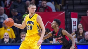 Jan 21, 2016; Piscataway, NJ, USA; Rutgers Scarlet Knights guard Omari Grier (31) defends against Iowa Hawkeyes forward Jarrod Uthoff (20) in the second half at Louis Brown Athletic Center. Iowa defeats Rutgers 90-76. Mandatory Credit: William Hauser-USA TODAY Sports