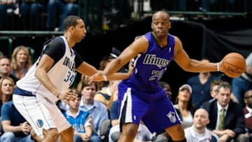 Jan 31, 2014; Dallas, TX, USA; Sacramento Kings power forward Carl Landry (24) dribbles as Dallas Mavericks power forward Brandan Wright (34) defends during the game at American Airlines Center. Dallas won 107-103. Mandatory Credit: Kevin Jairaj-USA TODAY Sports