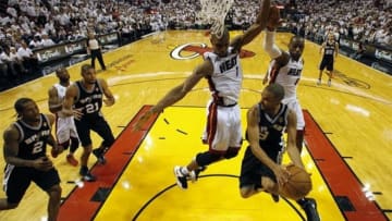 Jun 18, 2013; Miami, FL, USA; San Antonio Spurs point guard Tony Parker (9) passes against Miami Heat center Chris Bosh (1) and small forward LeBron James (6) during the second half of game six in the 2013 NBA Finals at American Airlines Arena. Mandatory Credit: Mike Segar\Pool Photo-USA TODAY Sports