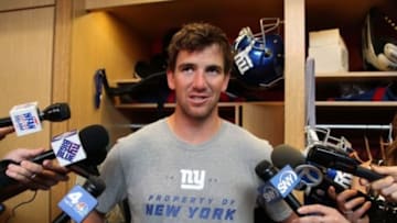 Jun 18, 2014; East Rutherford, NJ, USA; New York Giants quarterback Eli Manning (10) answers questions from media during New York Giants mini camp at Quest Diagnostics Training Center. Mandatory Credit: Noah K. Murray-USA TODAY Sports