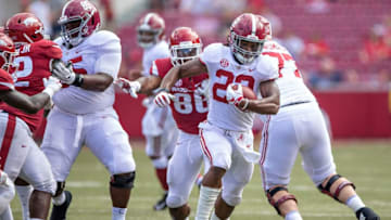 FAYETTEVILLE, AR - OCTOBER 6: Najee Harris #22 of the Alabama Crimson Tide runs the ball in the second half during a game against the Arkansas Razorbacks at Razorback Stadium on October 6, 2018 in Tuscaloosa, Alabamai. The Crimson Tide defeated the Razorbacks 65-31. (Photo by Wesley Hitt/Getty Images)