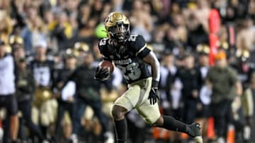 BOULDER, CO - NOVEMBER 6: Running back Jarek Broussard #23 of the Colorado Buffaloes rushes for a first down against the Oregon State Beavers at Folsom Field on November 6, 2021 in Boulder, Colorado. (Photo by Dustin Bradford/Getty Images)
