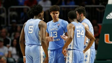 MIAMI, FLORIDA - JANUARY 19: Cameron Johnson #13 of the North Carolina Tar Heels huddles with his teammates against the Miami Hurricanes during the second half at Watsco Center on January 19, 2019 in Miami, Florida. (Photo by Michael Reaves/Getty Images)