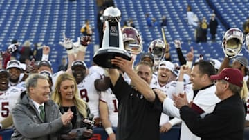 Dec 3, 2016; Annapolis, MD, USA; Temple Owls head coach Matt Rhule hoist the American Athletic Conference football trophy during a post game celebration after defeating Navy Midshipmen 34-10 at Navy-Marine Corps Memorial Stadium. Mandatory Credit: Tommy Gilligan-USA TODAY Sports