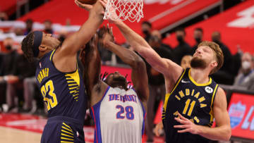 Isaiah Stewart #28 of the Detroit Pistons battles for the ball with Myles Turner #33 and Domantas Sabonis (Photo by Leon Halip/Leon Halip)