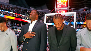 SAN ANTONIO,TX - OCTOBER 18: Former Spurs David Robinson joins injured Kawhi Leonard (Photo by Ronald Cortes/Getty Images)
