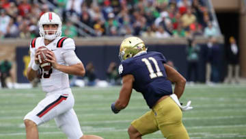 SOUTH BEND, IN - SEPTEMBER 08: Riley Neal #15 of the Ball State Cardinals is chased by Alohi Gilman #11 of the Notre Dame Fighting Irish at Notre Dame Stadium on September 8, 2018 in South Bend, Indiana. (Photo by Jonathan Daniel/Getty Images)