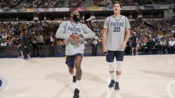 Kyle O'Quinn and Doug McDermott (Photo by Ron Hoskins/NBAE via Getty Images)
