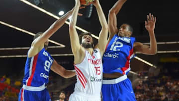 Turkey's Furkan Aldemir (15) battles for a rebound against the Dominican Republic during a group-stage game at the FIBA World Cup in Spain earlier this year. (FIBA photo)