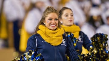 Nov 5, 2016; Morgantown, WV, USA; A West Virginia Mountaineers dancer performs during the third quarter against the Kansas Jayhawks at Milan Puskar Stadium. Mandatory Credit: Ben Queen-USA TODAY Sports
